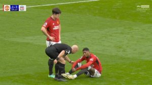 Marcus Rashford looks distressed as he is forced off injured in Man Utd’s clash against Liverpool