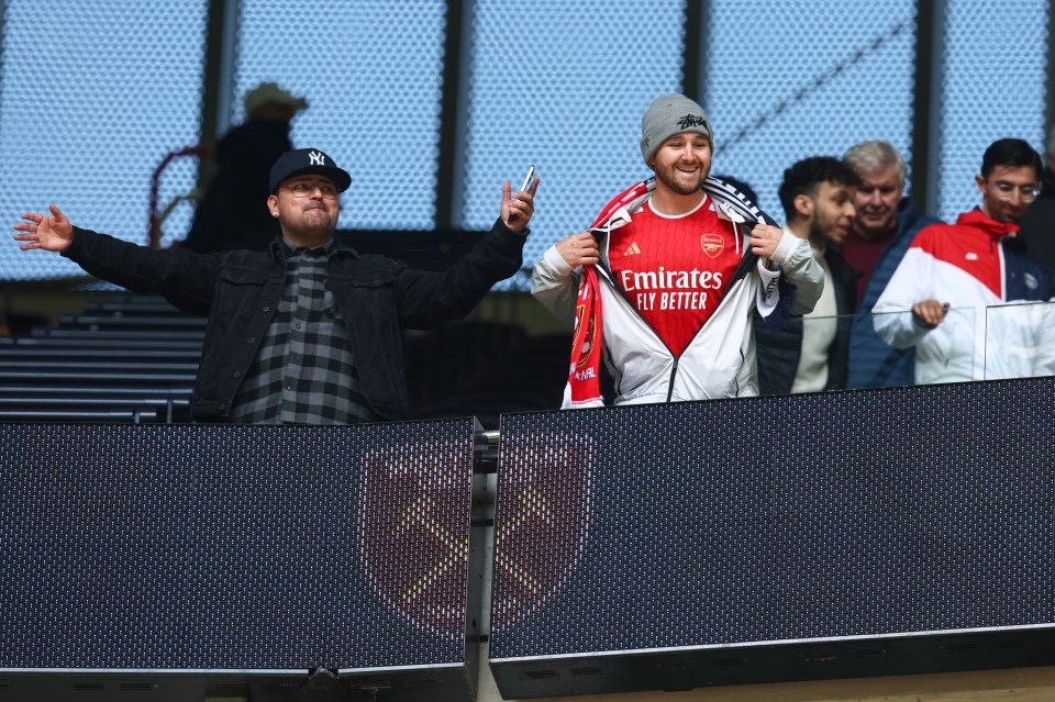 ‘Bravest fan in the world’ spotted in the Tottenham end with an ARSENAL shirt after turning up with wrong ticket