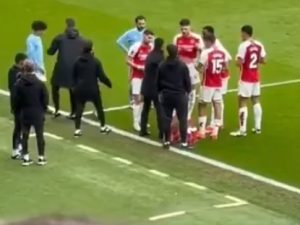 Man City star spotted sneaking up on Arsenal huddle to listen to Arteta’s tactics and fans think they know what he heard