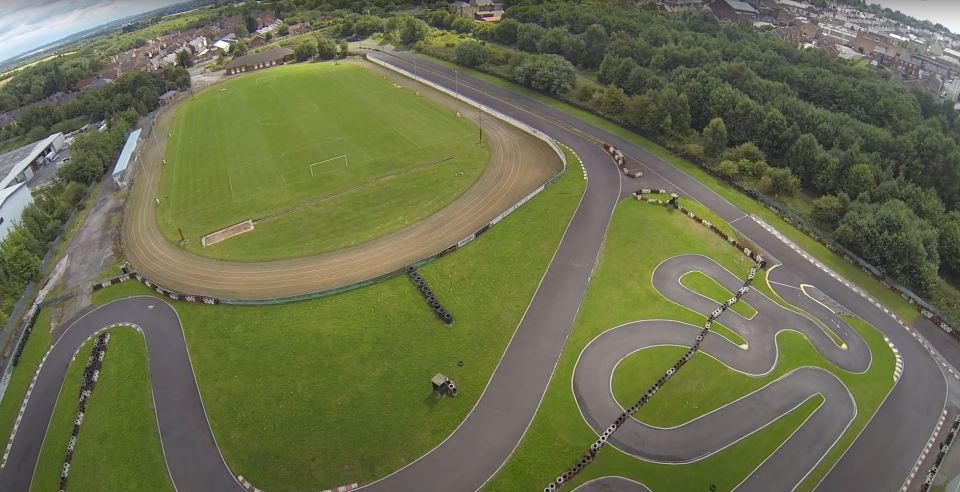 Inside UK football stadium with race track behind goal where Lewis Hamilton and Jenson Button learned to be F1 stars