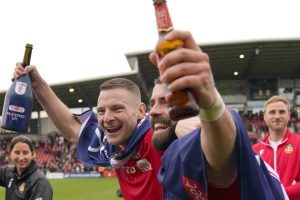 Ryan Reynolds in tears as Wrexham fans invade pitch after securing League One PROMOTION as Hollywood rise continues