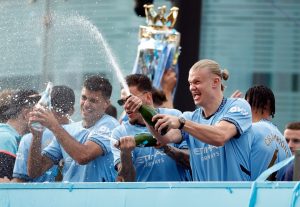 Man City celebrate winning fourth successive Premier League title with open-top bus victory tour despite rain