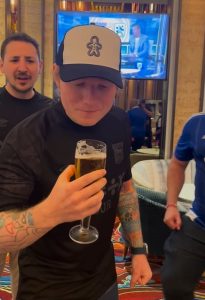 Watch Ed Sheeran down beer with Ipswich fans and FaceTimes players as he celebrates promotion to Premier League