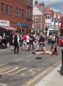 Shocking moment Man Utd and City fans brawl in the street before FA Cup final – leaving shirtless man knocked out cold