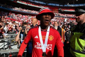 Watch ‘wholesome’ moment Kobbie Mainoo asks Man Utd fan for THAT bucket hat he wore after FA Cup final heroics