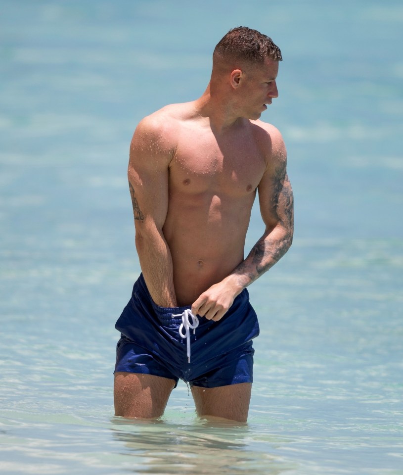 Luton ace Ross Barkley flaunts shredded abs on sunny Barbados beach with girlfriend Katherine Pilkington