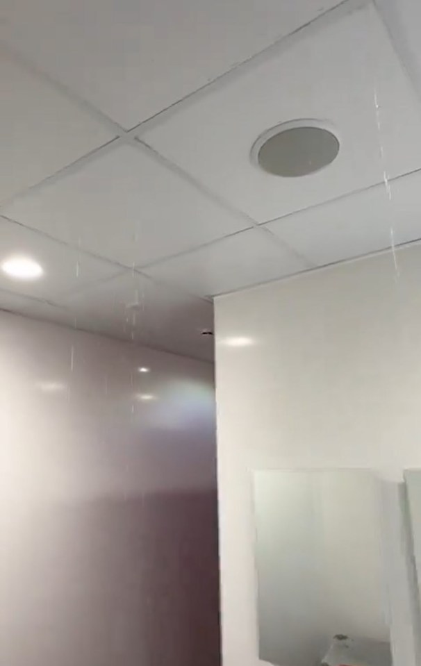 Shocking video shows Old Trafford away dressing room FLOODED as water pours through roof after Arsenal’s win at Man Utd