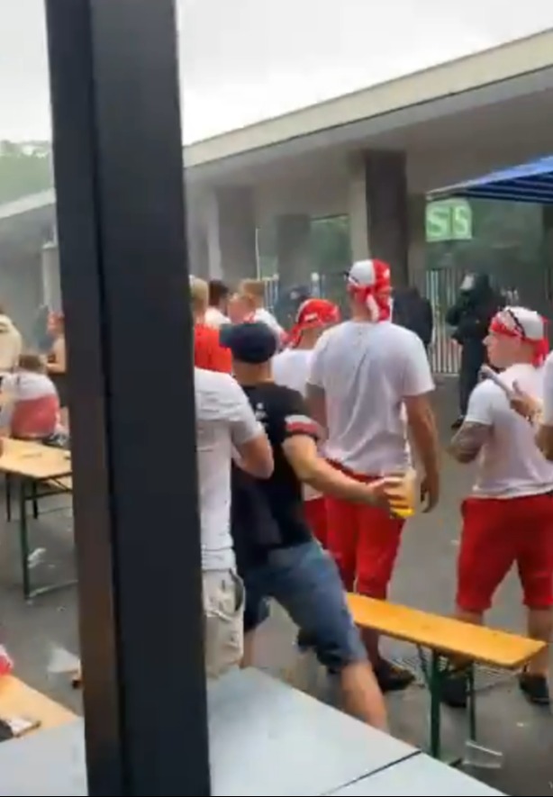 Watch German riot cop floor football fan with huge punch after supporter ‘threw bottle at police’ ahead of Euros clash