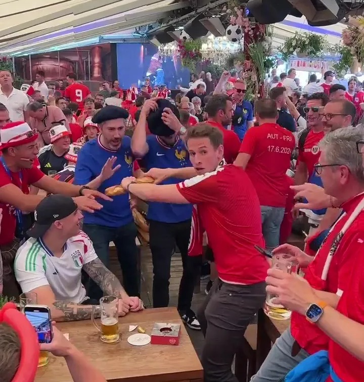 Watch Austrian supporters taunt French fans by snapping BAGUETTES in front of them ahead of Euro 2024 clash