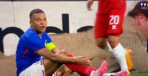 Watch the hilarious moment Kylian Mbappe is left terrified by creepy man on advertising hoarding during France match