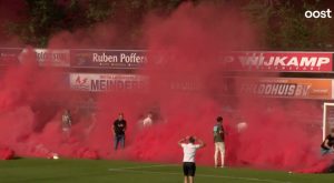 Horror moment huge banner comes crashing down during match injuring around 10 fans as hospital helicopters land on pitch