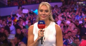 Emma Paton stuns in bold sleeveless outfit as she presents World Cup of Darts from Germany