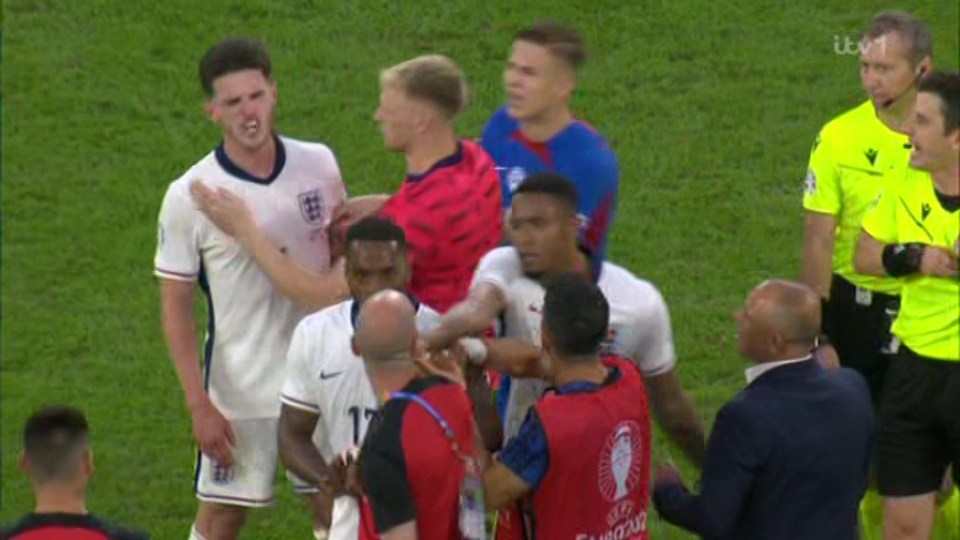 Watch moment furious Declan Rice is held back by Aaron Ramsdale after being pushed by Slovakia boss in row at Euro 2024