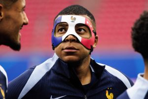 Why is Kylian Mbappe wearing a mask at Euro 2024?