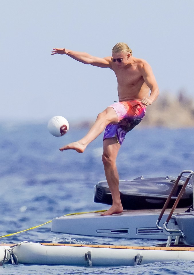 Man City’s Erling Haaland lets his hair down as he boots a ball around on yacht in Cannes after missing Euro 2024