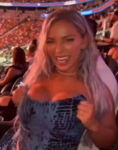 Shock moment OnlyFans model repeatedly flashes boobs in crowd at UFC before she is kicked out by security