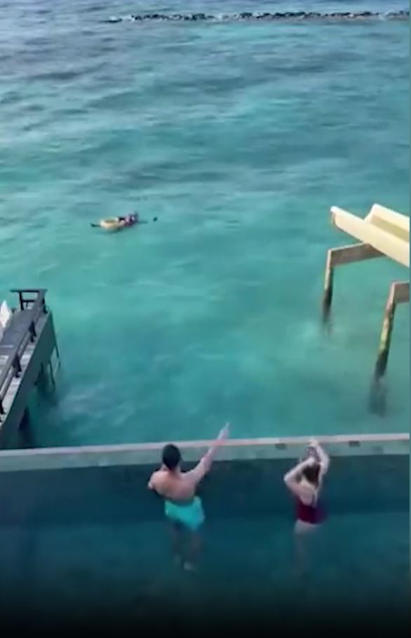 Incredible moment hero former Real Madrid star hurtles down slide to rescue couple from drowning on Maldives holiday