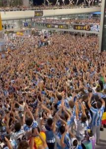 Chaos as thousands of Malaga fans swarm airport in sea of blue as fallen giants win promotion to Spanish second tier