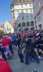 Shocking moment Serbian ultras launch bottles at riot police in chaotic street brawl at Euro 2024