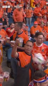 Watch unfortunate moment Dutch fan is hit flush in the face by football as he poses for cameras – and drops his beer