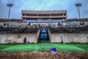 Abandoned Olympics stadium looks a shadow of its former self with disintegrating stands and overgrown grounds