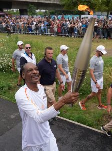 Watch moment rap legend Snoop Dogg dances with Paris Olympics 2024 torch through streets of city before opening ceremony