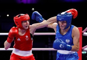 Fans fume ‘absolutely robbed’ after Team GB boxer is knocked out of Olympics as shocked star says ‘I knew I’d won’