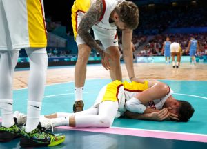 Horror moment basketball star hit in the face by his own team-mate’s KNEE in crunch Paris 2024 Olympics showdown