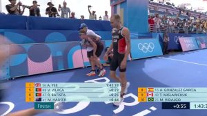 Chaos at end of Paris Olympics triathlon as runner VOMITS on the line while exhausted rivals collapse around him