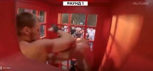 Watch crazy moment fighters pummel each other inside phone box in bizarre sport