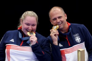 Why do Olympians bite their medals?