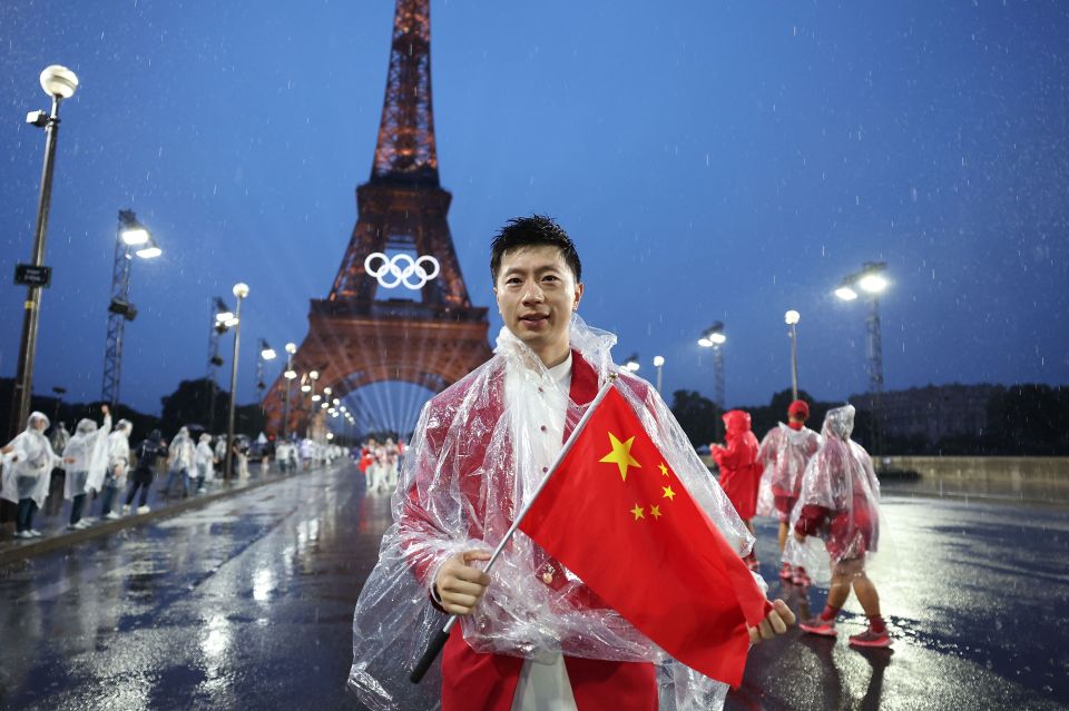 Why do table tennis players blow on their paddle and the ball before serving at the Olympics?