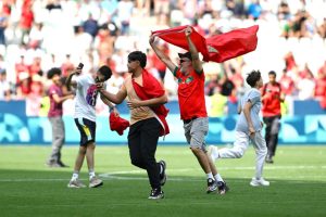 Chaos at Paris Olympics as athletes flee after fans ‘invade pitch and throw firecracker’ just hours into opening event