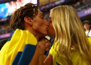 Olympic champion Armando Duplantis kisses model girlfriend then repeatedly PUNCHES brother as he celebrates record