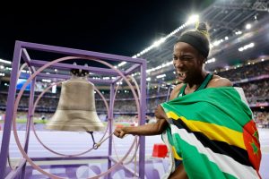 Why do gold medal Olympians ring the bell at the Stade de France and will it be hung at the Notre Dame cathedral?