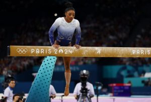 Simone Biles falls off beam in quest for fourth Paris Olympics gold after Suni Lee’s painful slip during dramatic final