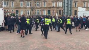 Shocking moment Rangers fans clash with police at Hampden ahead of St Johnstone cup clash as woman knocked to ground