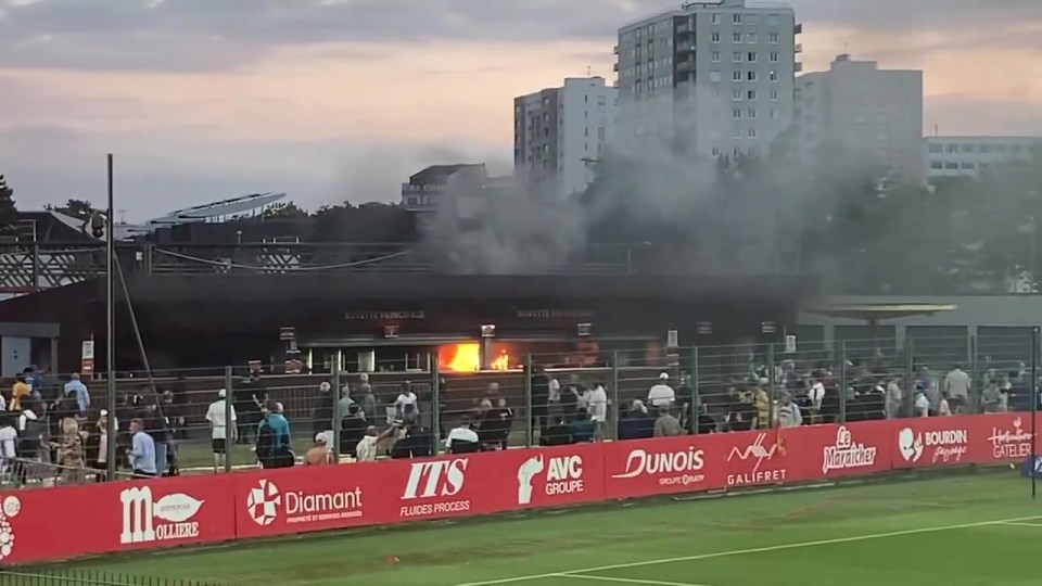 Players rushed off the pitch as FIRE breaks out in stadium as cup game ABANDONED with pitch engulfed in cloud of smoke