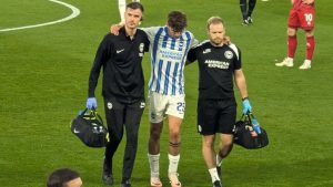 Matt O’Riley helped off by Brighton medics just EIGHT MINUTES into debut after £26million transfer from Celtic