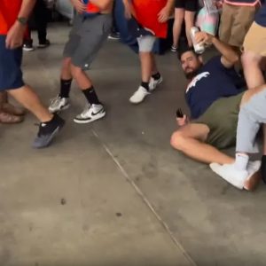 NFL fans in wild pre-season concourse brawl as Broncos supporter praised for ‘saving’ his beer during chaotic fight