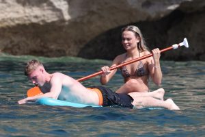 England hero Cole Palmer relaxes with mystery woman as pair enjoy paddleboard outing on holiday in Ibiza