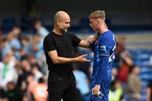 Fans say Pep Guardiola is ‘apologising for letting him leave’ as Man City boss chats to Chelsea’s Cole Palmer after win