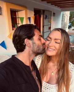 Laura Woods looks loved-up with Adam Collard as boyfriend kisses her during romantic Ibiza getaway