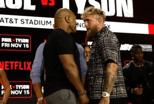 Watch Mike Tyson, 58, PUNCH Jake Paul before YouTuber, 27, pushes him away in face-off ahead of boxing fight