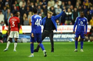 Shocking moment idiot pitch invader stopped from confronting Leicester boss Cooper by being tackled to ground by player