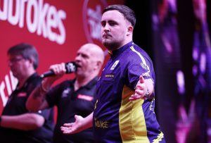 Luke Littler survives major wobble at World Series of Darts to beat Chris Dobey and reach semi-finals