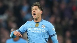 Stones’ 98th-minute equaliser salvages point for Man City against 10-man Arsenal