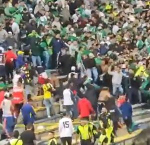 Horror as football match abandoned after machete-wielding hooligans spark brawl in stands and players are forced to flee