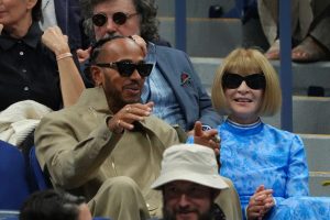 Lewis Hamilton receives fashion advice from Vogue editor Anna Wintour as they watch US Open Final