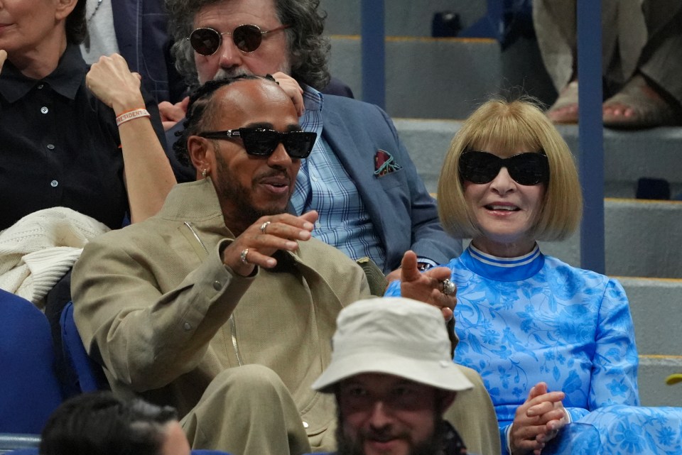 Lewis Hamilton receives fashion advice from Vogue editor Anna Wintour as they watch US Open Final